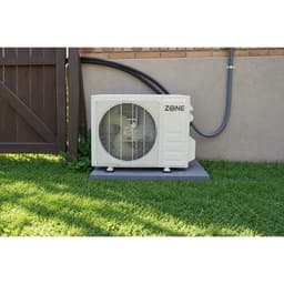 Zone Air outdoor condenser on a pad beside the house with the lineset connected